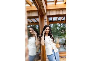 Smiling woman having phone, a Person Photo by HalfPoint