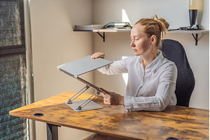 Woman working in her home office, a Person Photo by Elizaveta Galitskaya