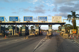 Toll booth under a blue cloudy sky, canelones, uruguay, a Transportation Photo by DanFLCreativo