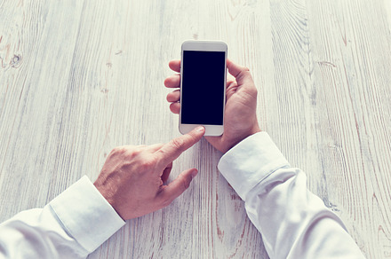 Man's hands using smartphone stock photo containing smartphone and phone