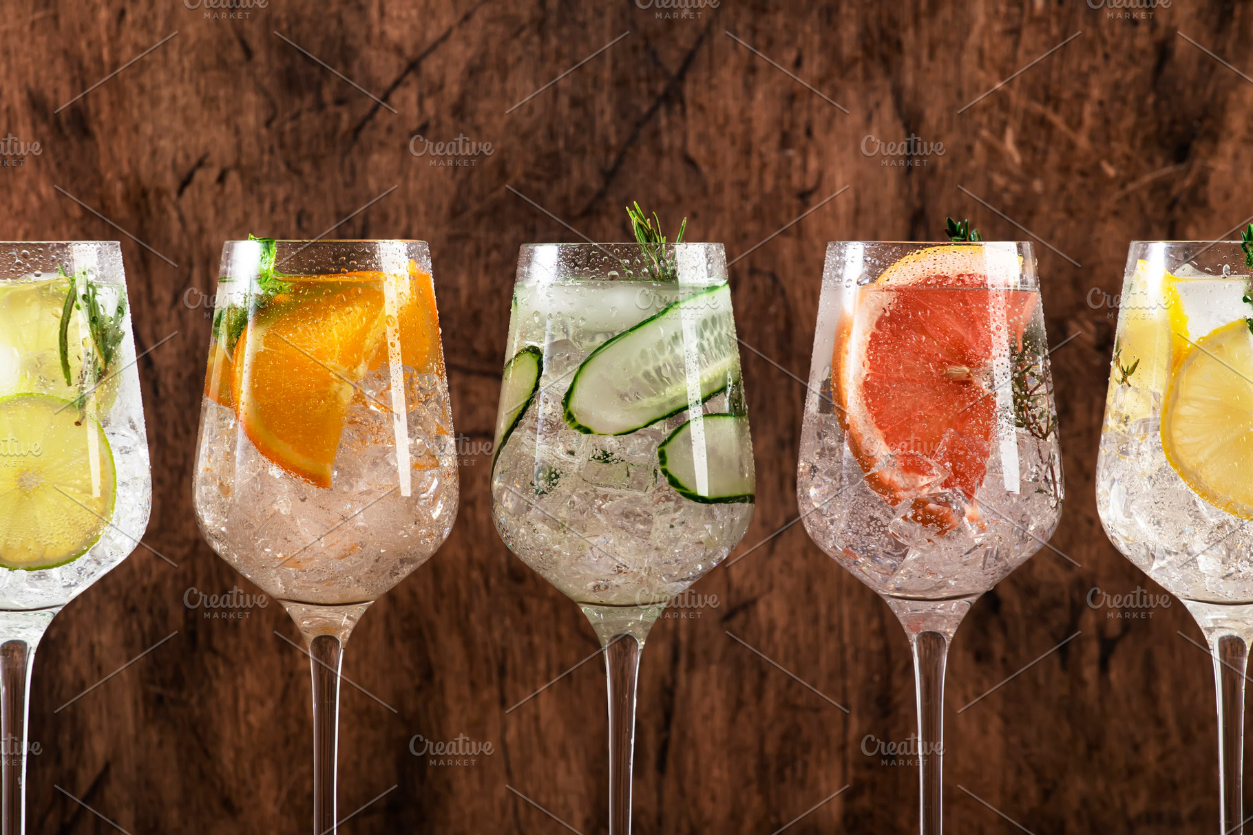 Gin and tonic cocktails set. Alcoholic drinks with lime, lemon,, a Food & Drink Photo by 5PH
