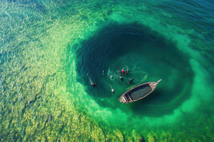 Aerial view of a wooden boats, a Photo by Pavel_design