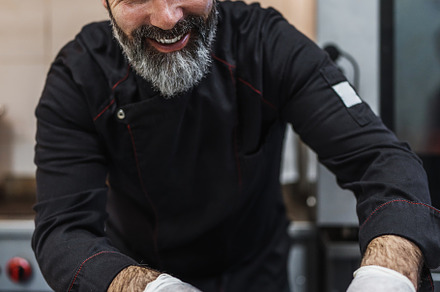 Professional chef preparing food, a Person Photo by REDDOT Studio
