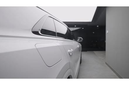 Side view of new white car in store, a Transportation Photo by Media Whale Stock