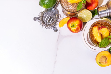 Iced peach tea, or peach lemonade, a Food & Drink Photo by Rimma