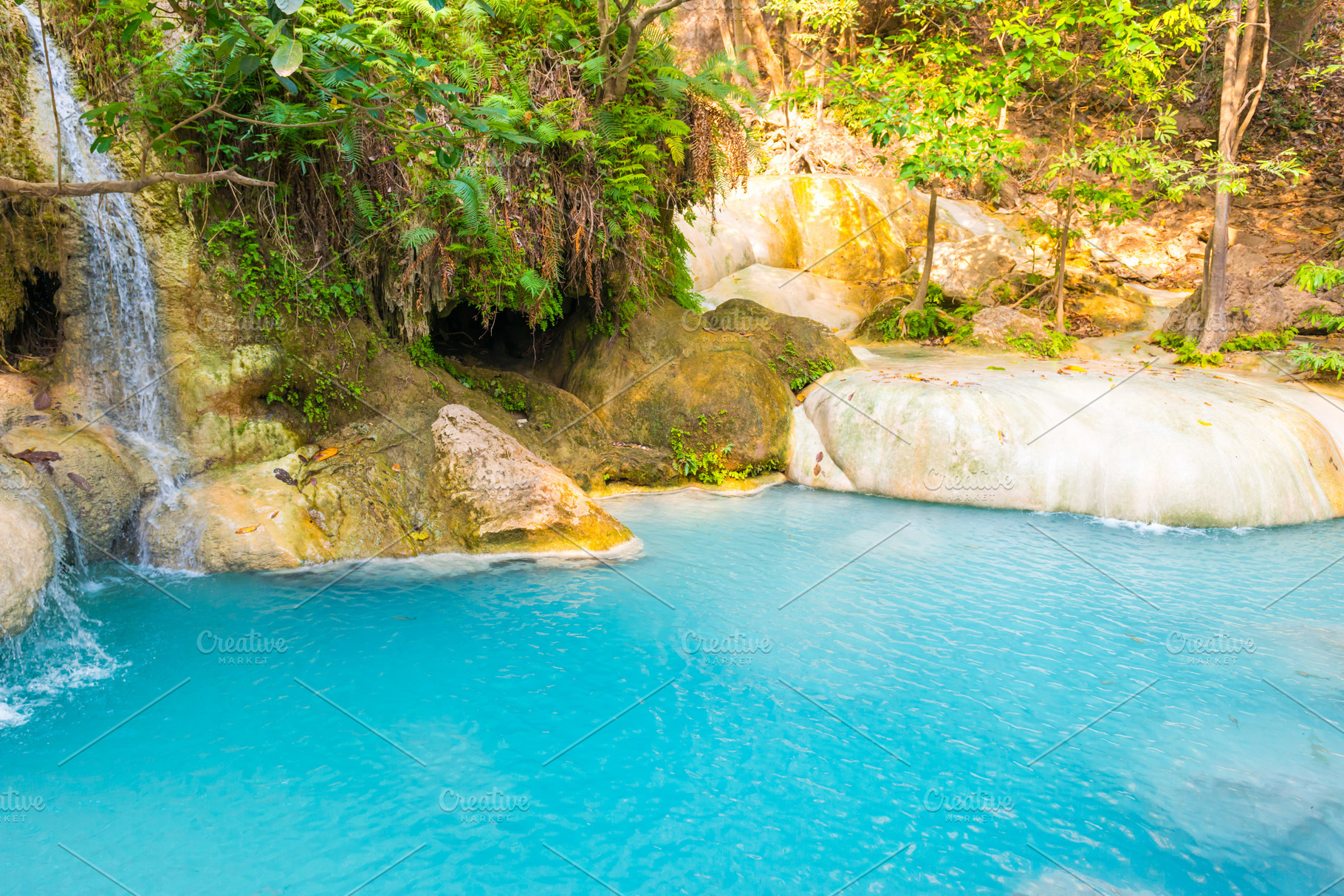 Lake with cascades of waterfall in tropical forest in Erawan, Th, a Nature Photo by Vapi