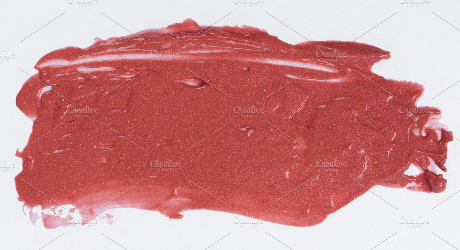 Texture of red glitter cosmetic smear, liquid lipstick on white, an Abstract Photo by ndanko