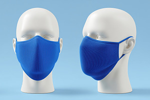 Two blue fabric masks mockup on white mannequin heads against a light blue back, a Mask Mockup by Textures & Backgrounds