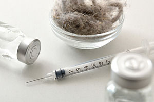 Syringe on a white table with vaccines elevated view, a Health & Medical Photo by Davizro's Market