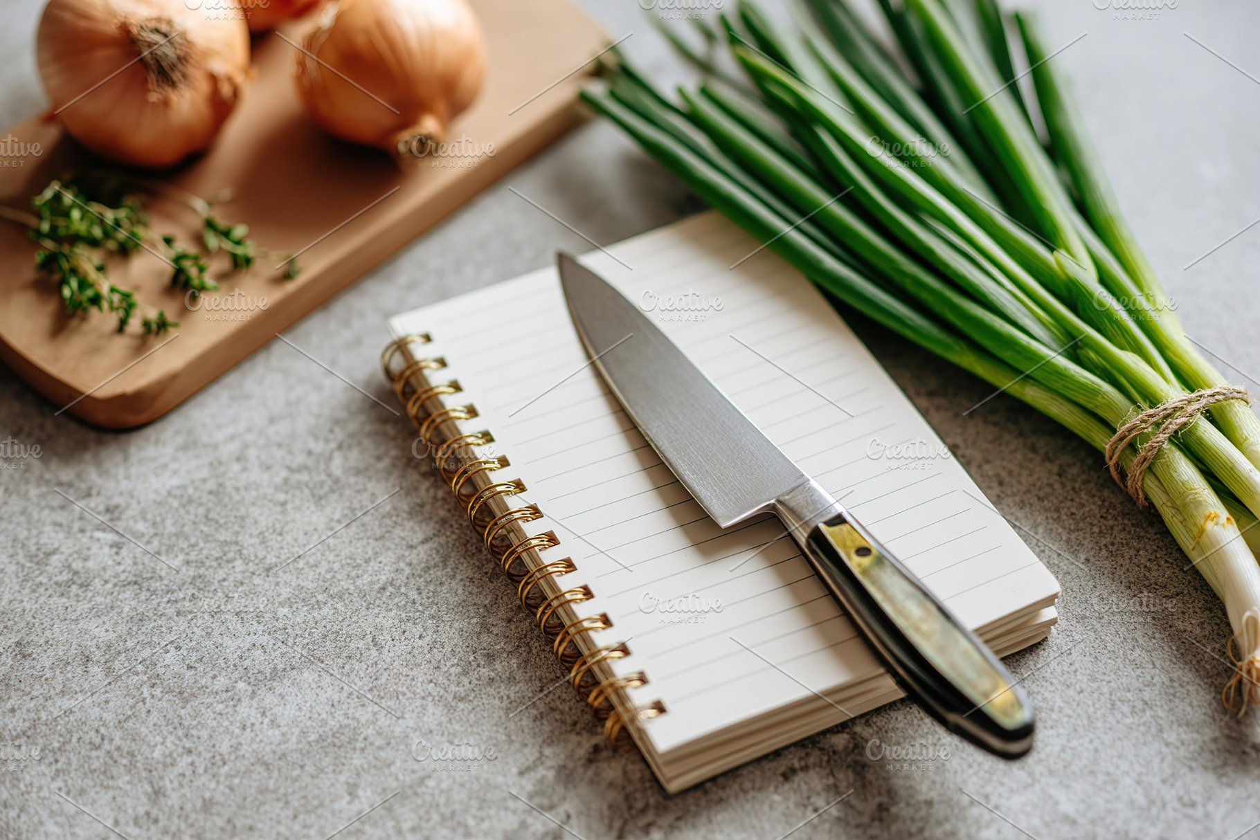 Fresh vegetables and a knife ready for cooking in a green themed kitchen settin, a Food & Drink Photo by AlyaAnd