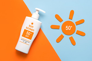 Top view of bottle of sunscreen, a Health & Medical Photo by esthermm