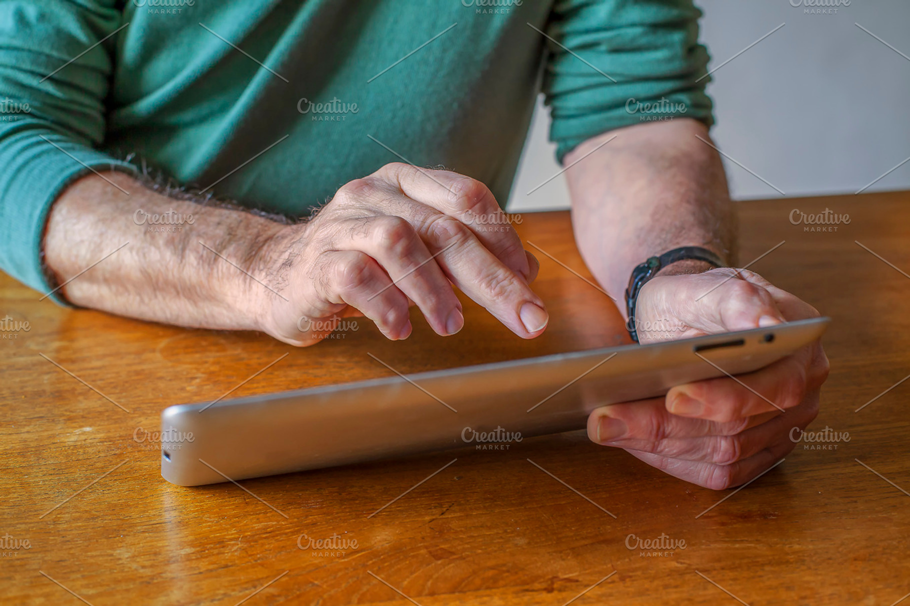 Man working with tablet containing man, work, and working