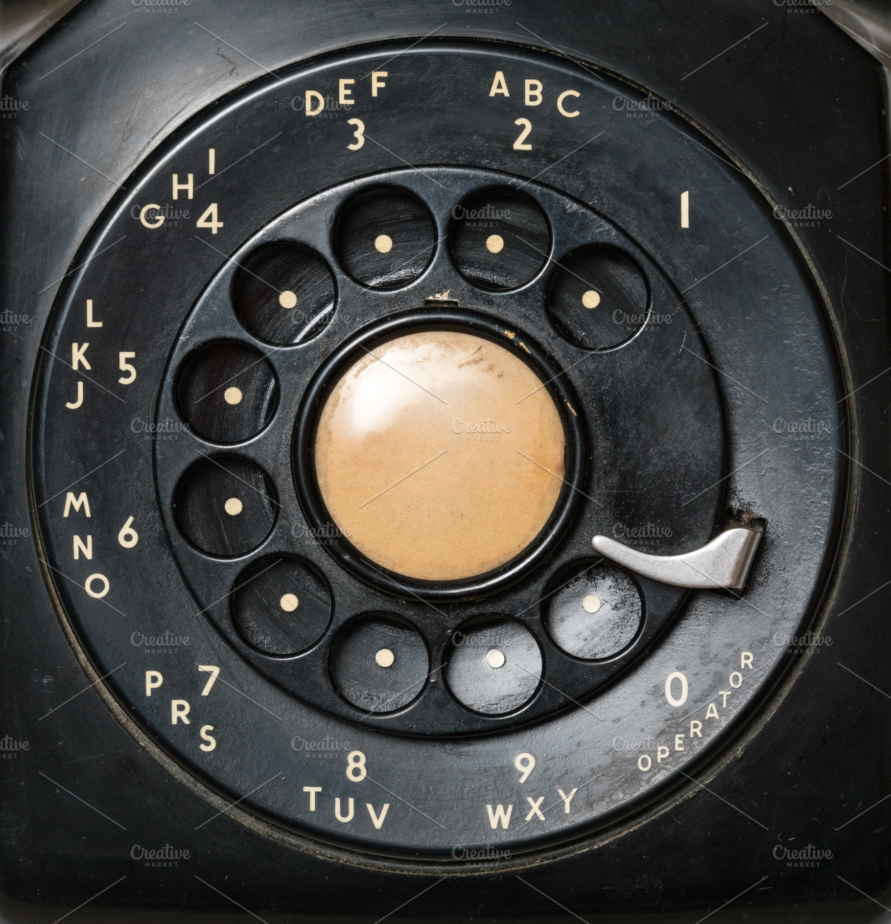 Close up of old rotary dial on telephone, a Technology Photo by Backyard Stock
