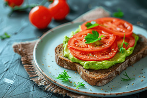 Toast bread with avocado puree and tomatoes on wooden table. Vegetarian food., a Food & Drink Photo by AlyaAnd