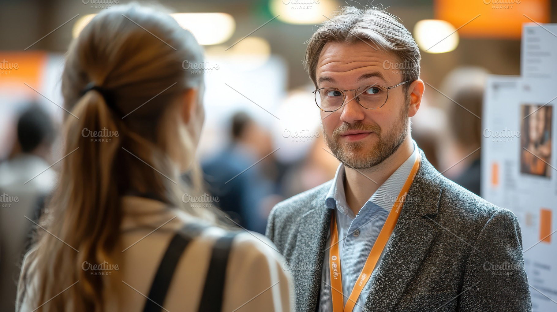 Young man in glasses talks with a wo, a Photo by Pixeness Studio