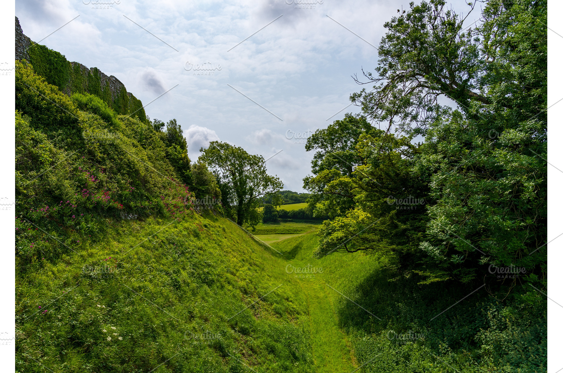 Moat underneath the walls of, an Architecture Photo by Backyard Stock