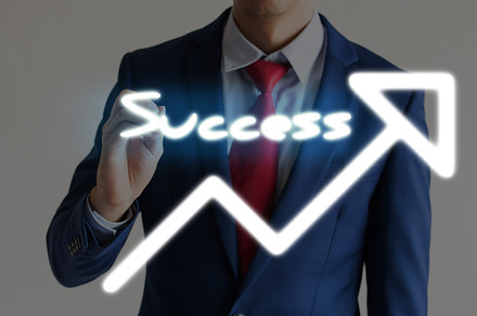 Businessman drawing SUCCESS and upward graph arrows forward, a Business Photo by Twinster Photo