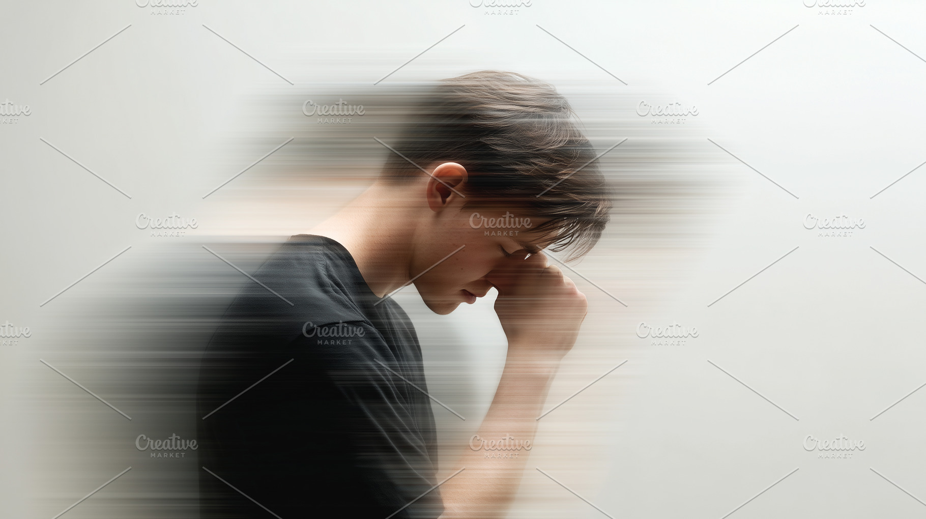 Young man stands with his head down, a Person Photo by MistyDay
