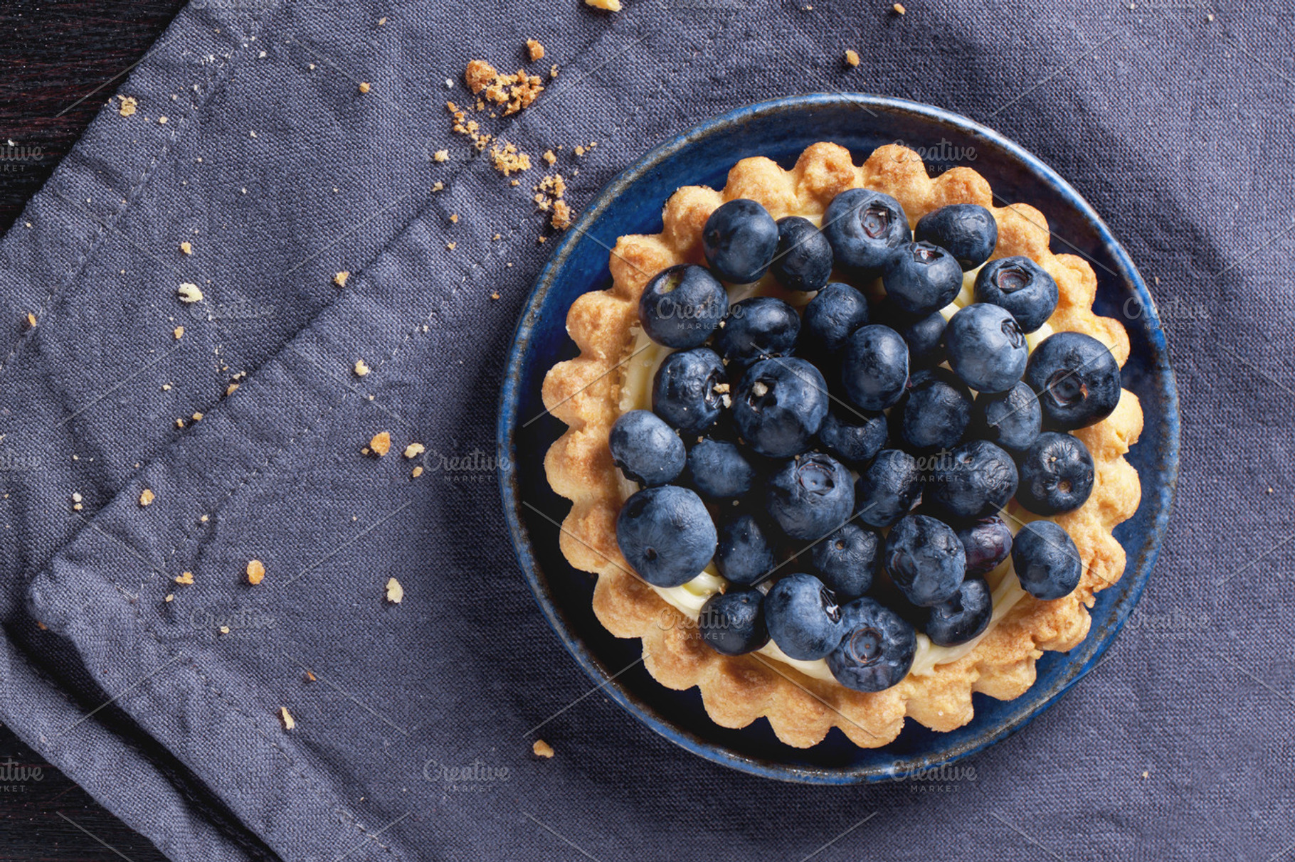Blueberry tart featuring cake, pie, and blueberry