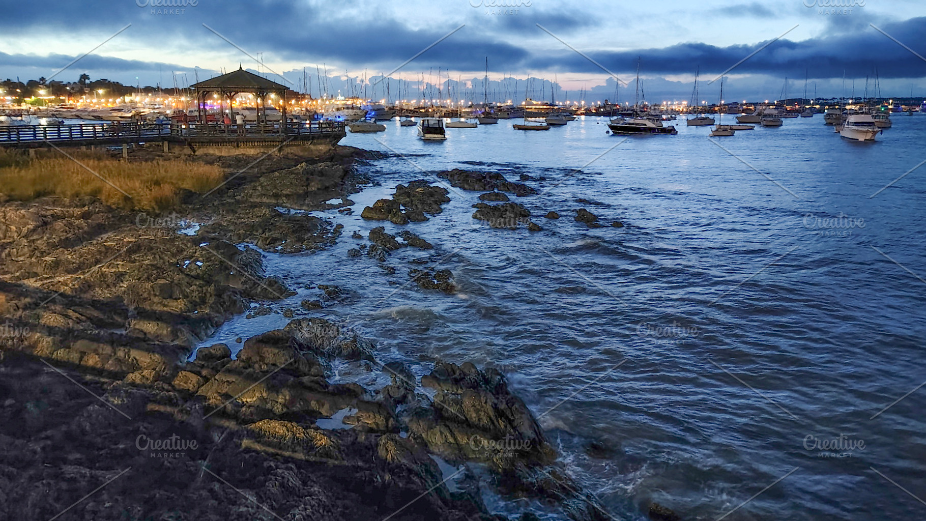 Rocky border and port at background, punta del este city, urugua, a Holiday Photo by DanFLCreativo