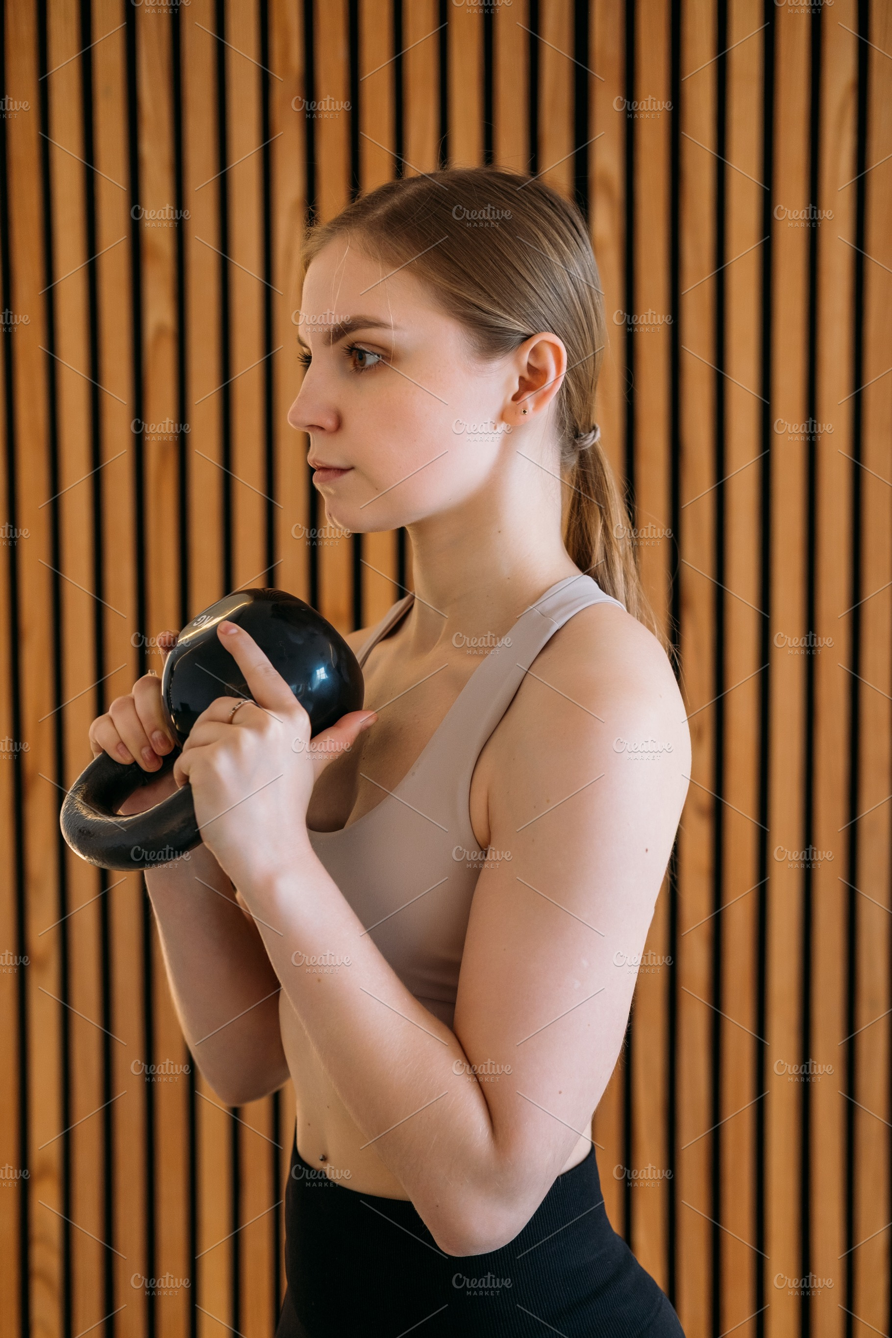 Kettlebell workout bodybuilder exercise female, a Person Photo by Photo Drive Studio
