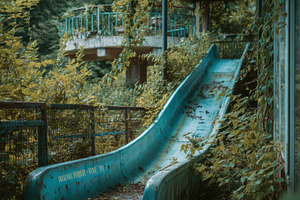 Abandoned slide in overgrown park, a Holiday Photo by Virgo Studio