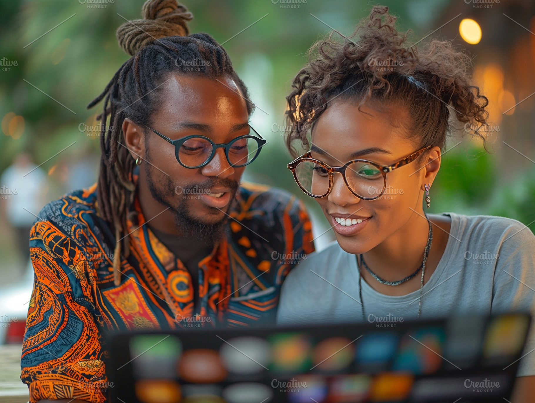 A young Black male and female with glasses smile as they share a light moment t, a Person Photo by ImageMir