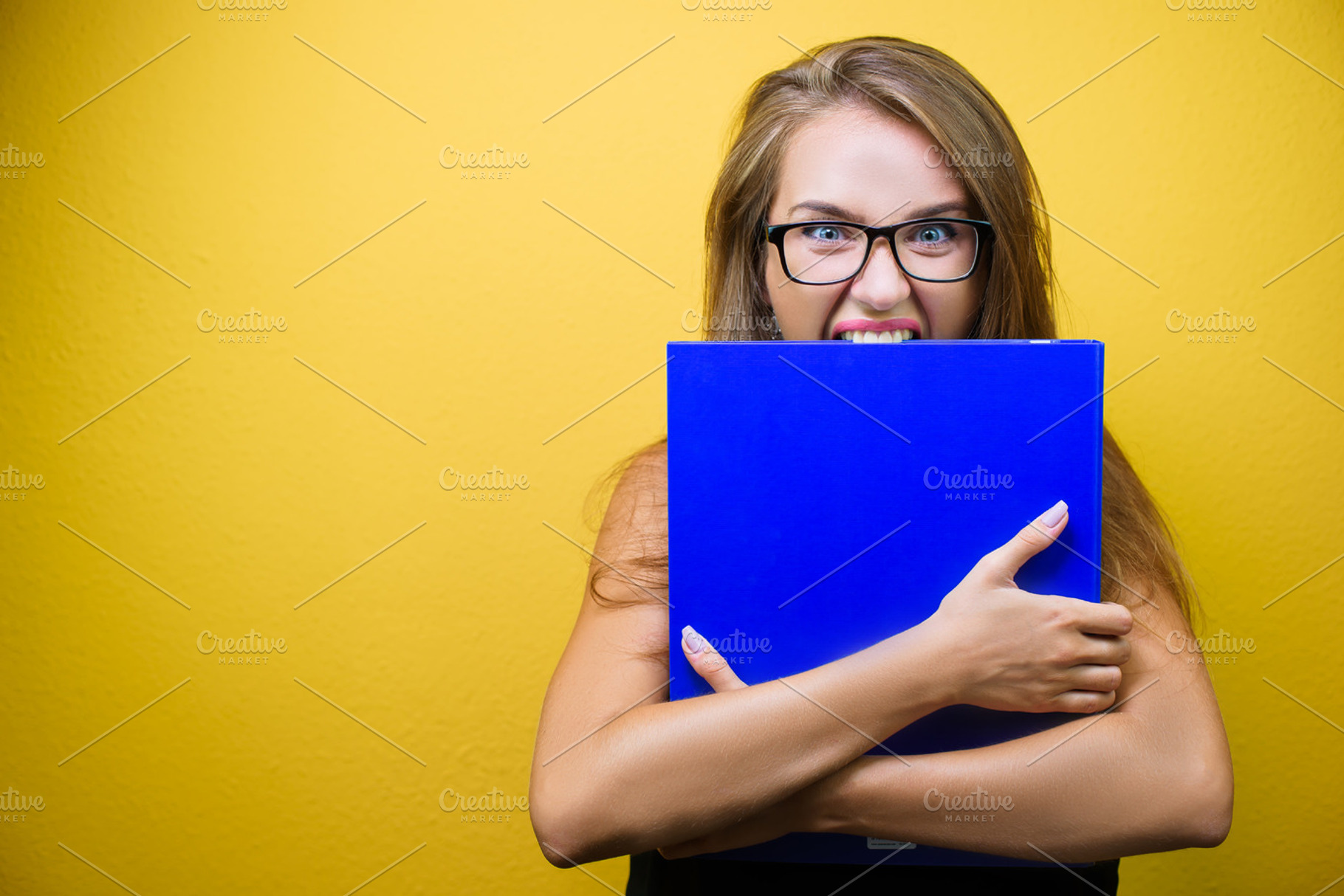 Portrait of a stressed woman featuring business, stress, and female, a Business Photo by BodiaPhoto