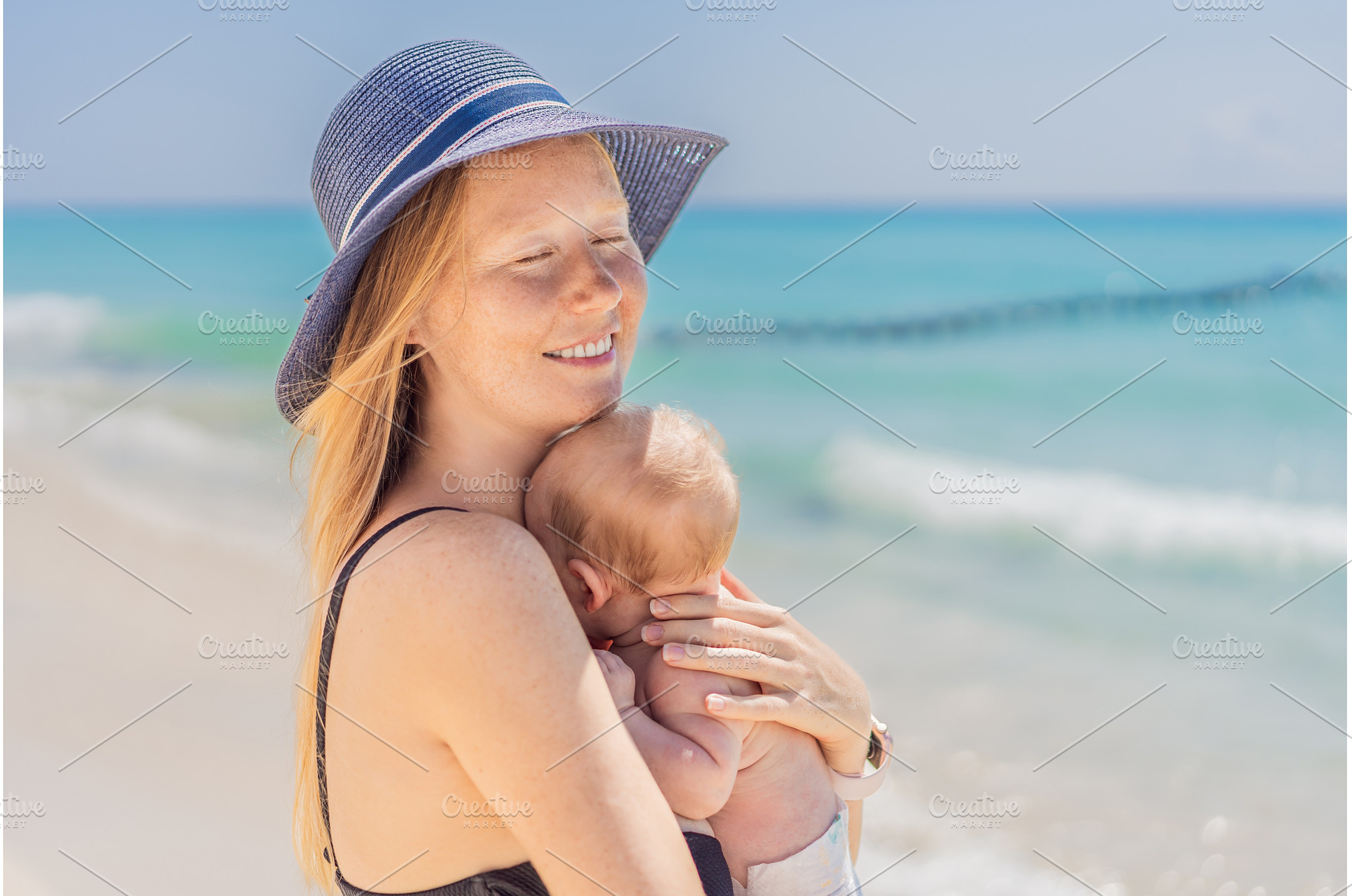 Mother holding her newborn baby by, a Person Photo by Elizaveta Galitskaya
