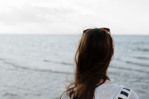 Woman looking at sea containing woman, sea, and adventure
