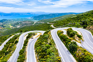 Winding road in the mountains of stock photo containing mountain and road, a Transportation Photo by Leonid Andronov