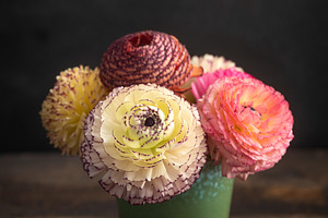 Ranunculus flowers in a vase featuring ranunculus, bouquet, and flowers