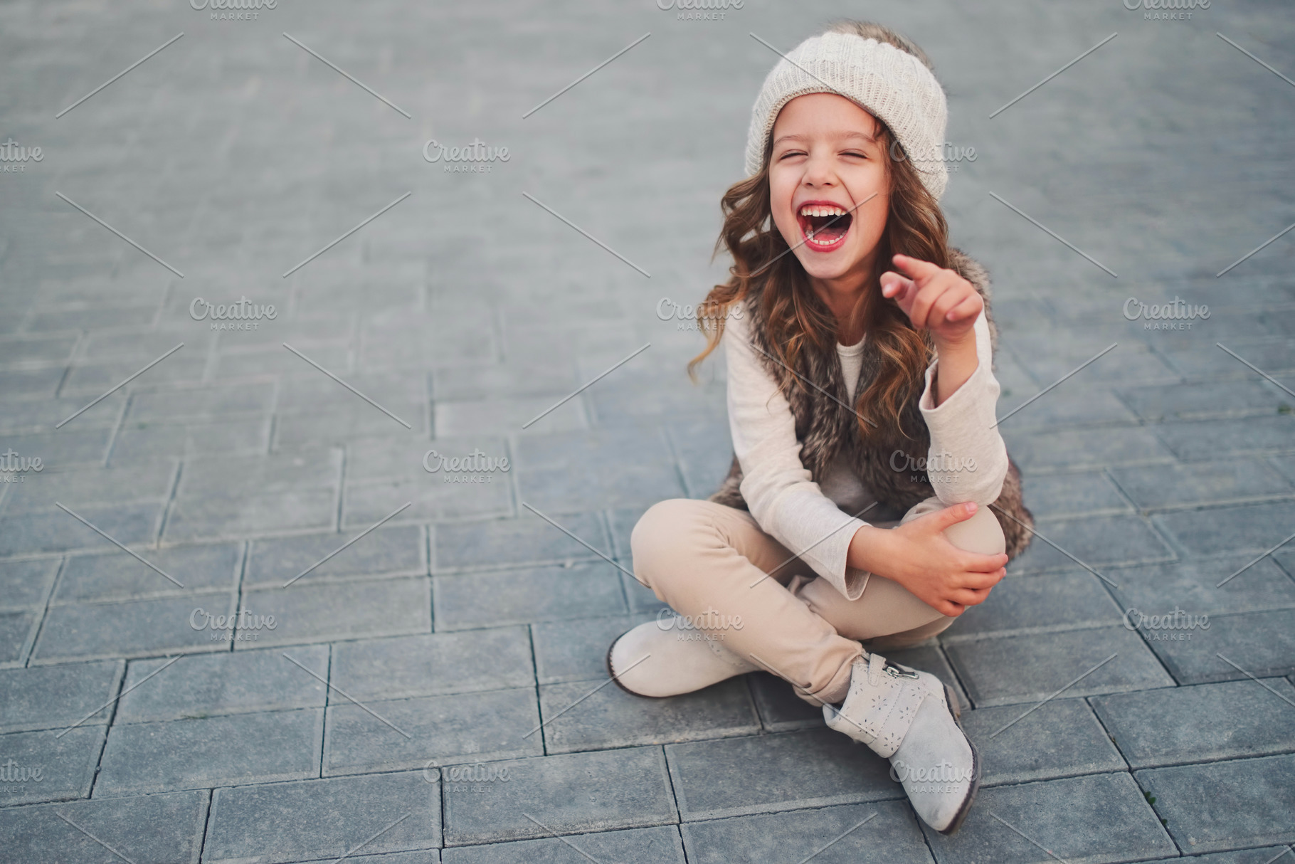 Cute little girl with knitted hat stock photo containing girl and hat, a Beauty & Fashion Photo by AlohaHawaii