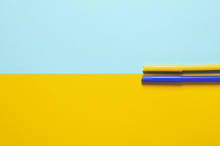 Two tone background in colors of Ukrainian flag with felt-tip pe, a School & Education Photo by AtlasStudio PRO