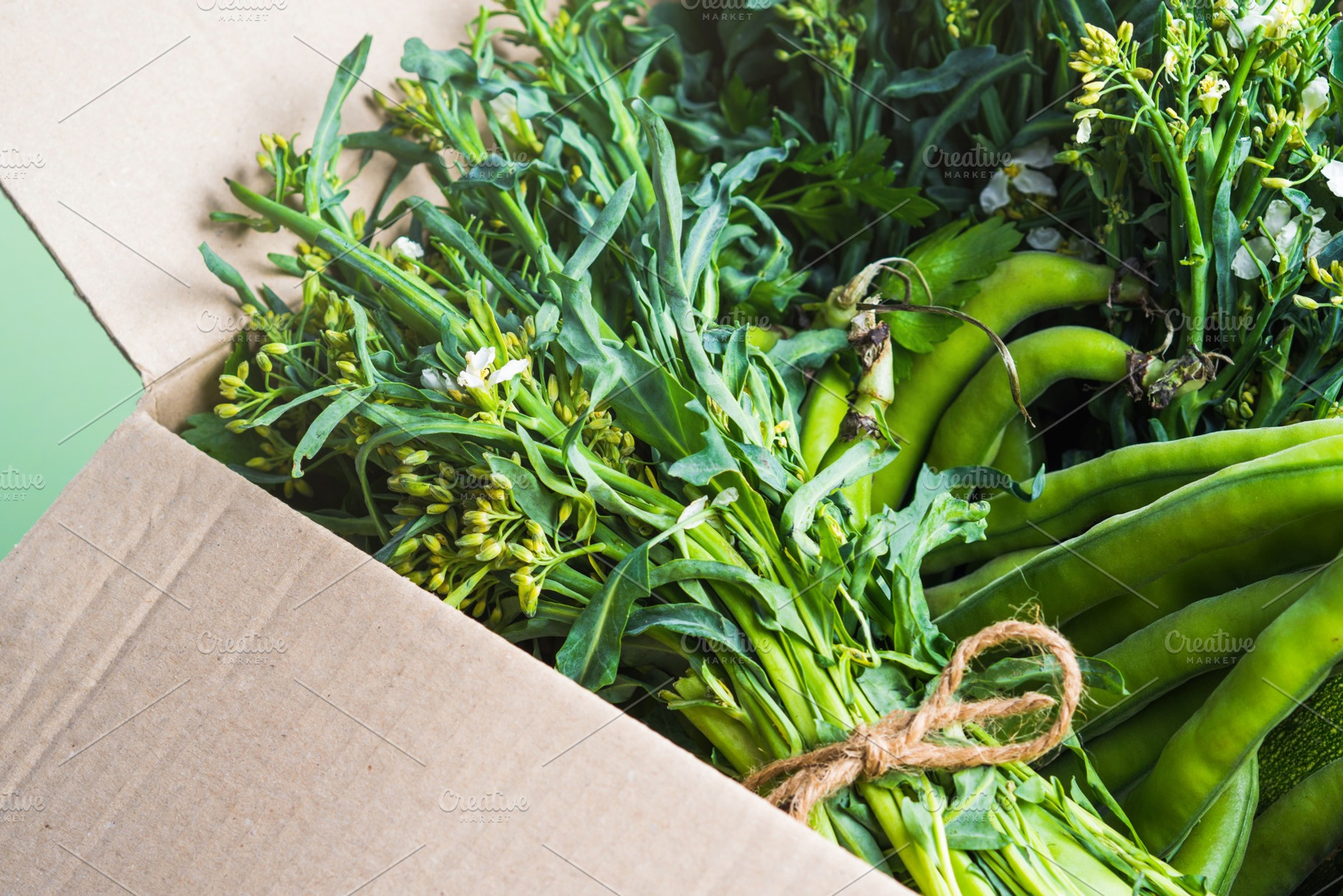 Green produce in cardboard box containing healthy, produce, and green, a Food & Drink Photo by Lifemorning