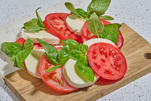 Classic Caprese salad with tomato slices, mozzarella and basil l, a Food & Drink Photo by ndanko