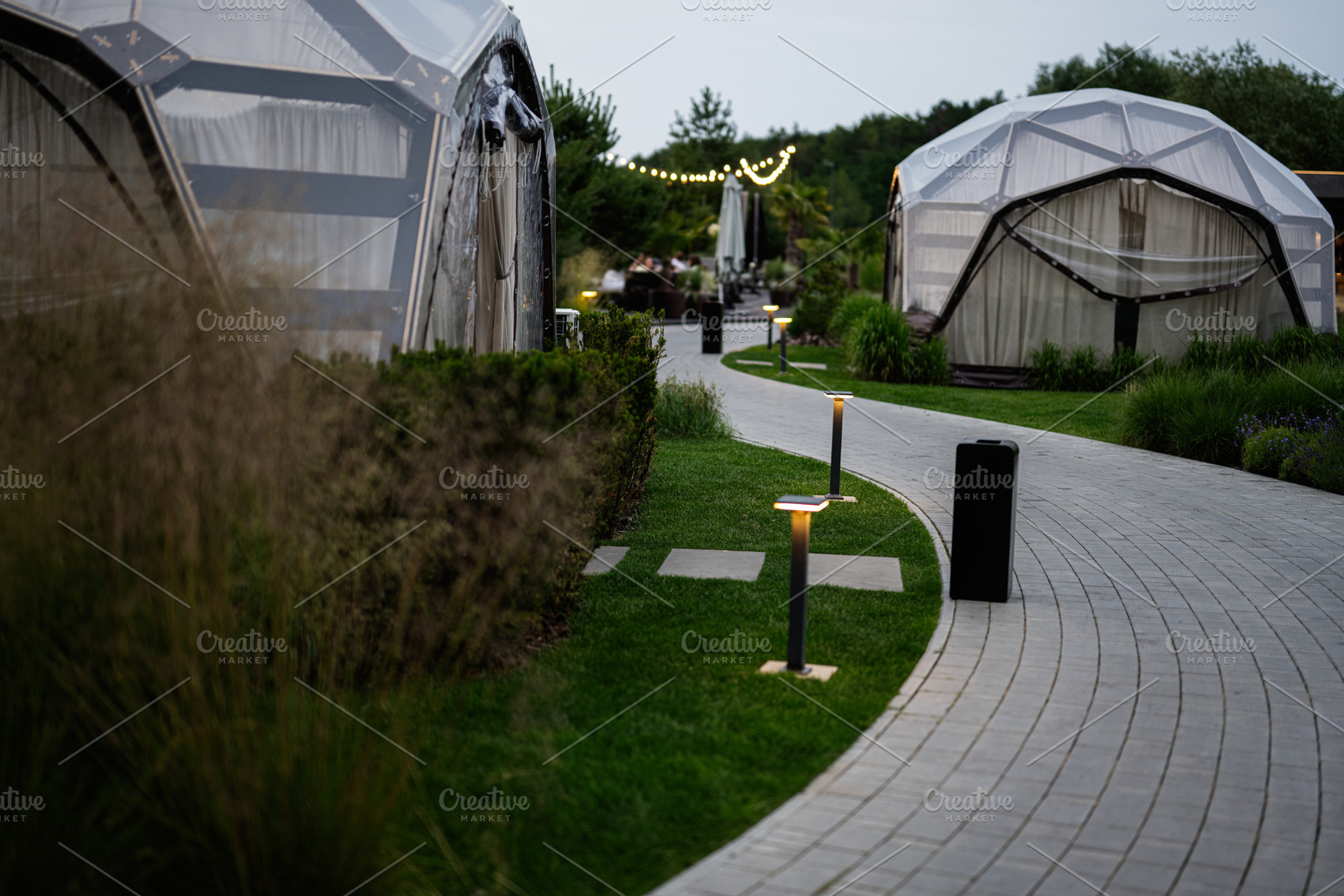Curved path surrounded by geodesic domes with soft lighting, a Photo by AS photostudio