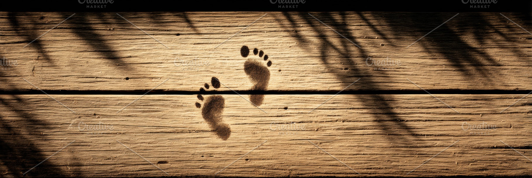 Child’s Footprints on Wooden Deck, a Person Photo by Virgo Studio