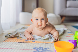 Little baby playing with toys on a, a School & Education Photo by Elizaveta Galitskaya