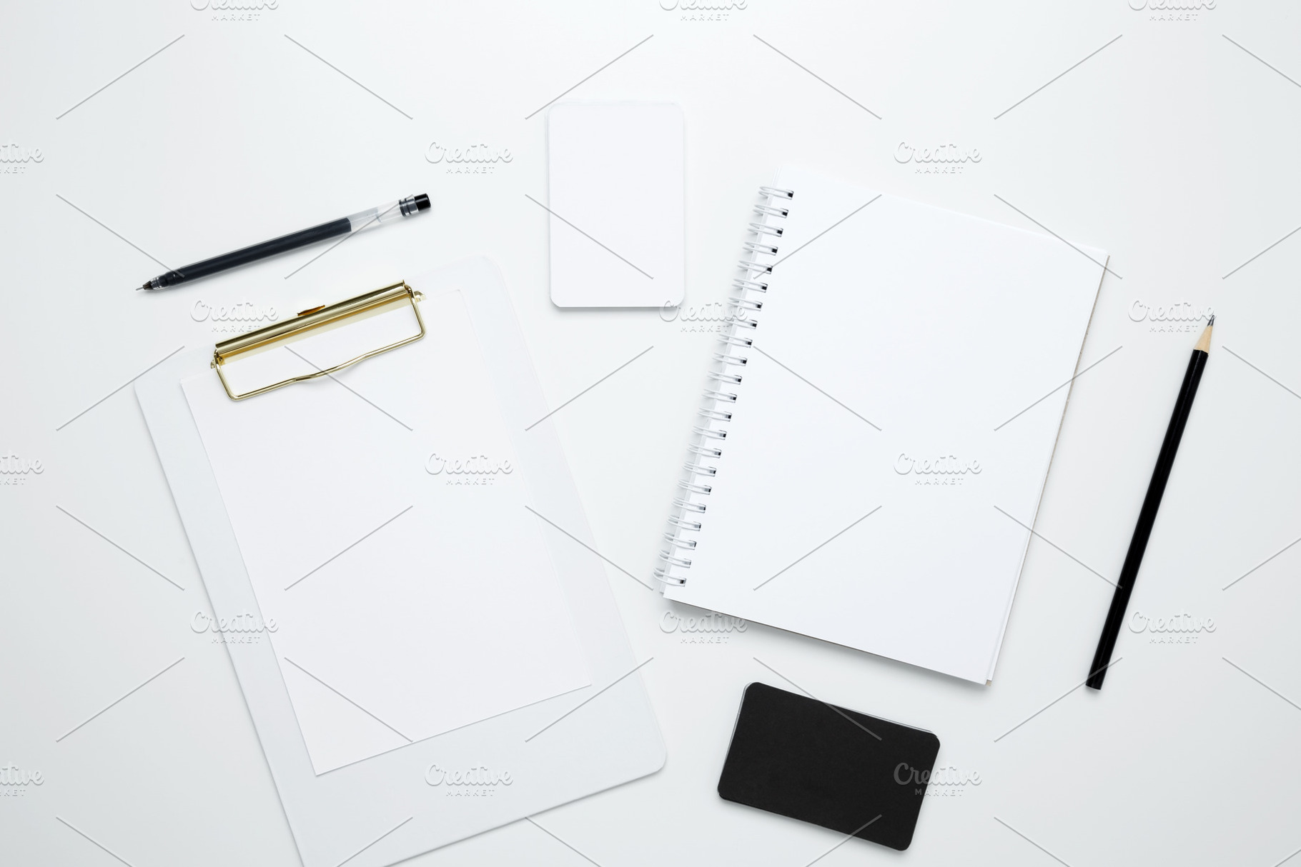 On a white background, an empty mock up notebook and clipboard, white and black, a Photo by matucha