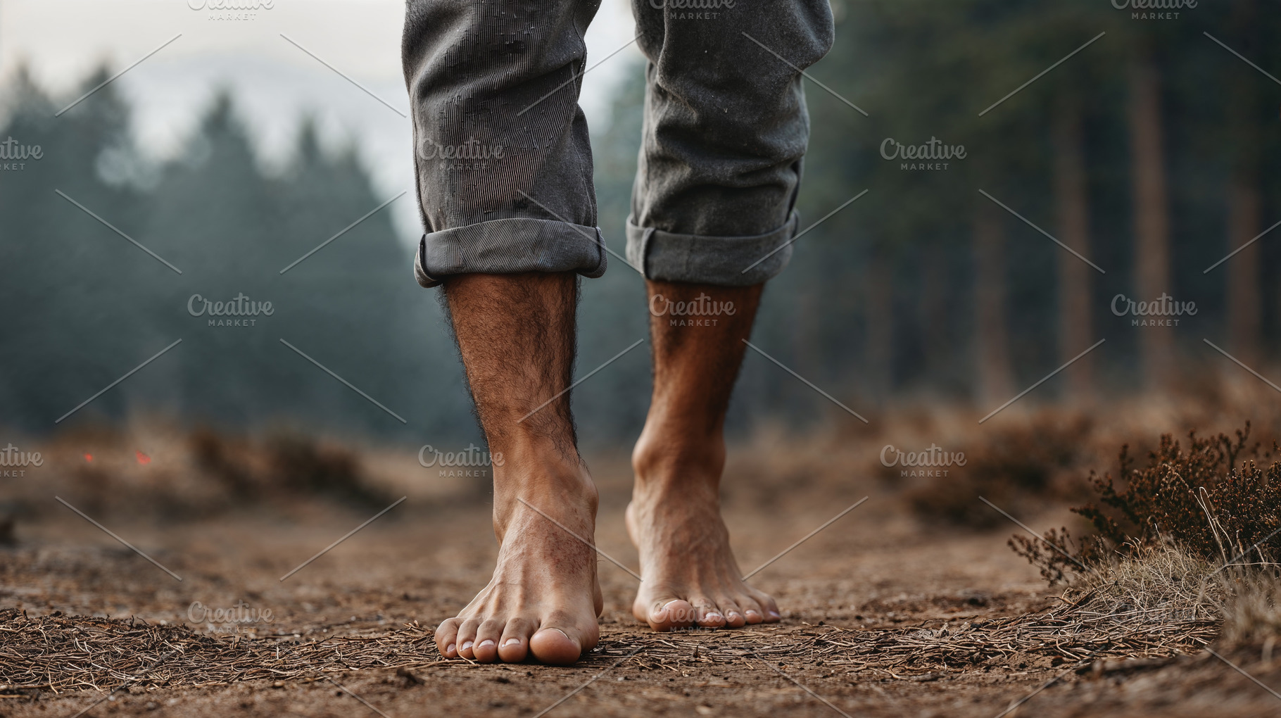 Barefoot wandering through forest path in serene morning light, a Person Photo by OSORIOartist