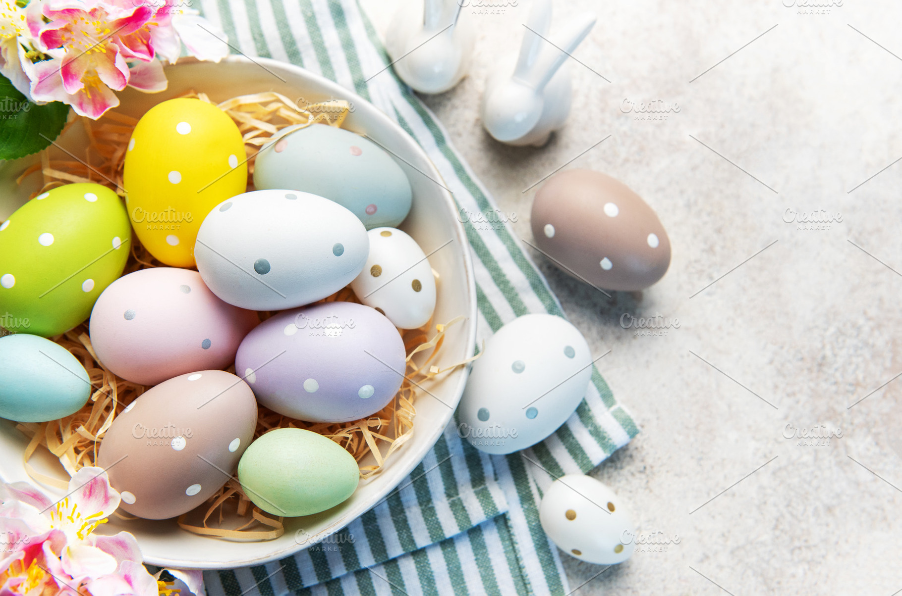Pastel easter eggs in nest with spring decoration, a Holiday Photo by Olena Rudo