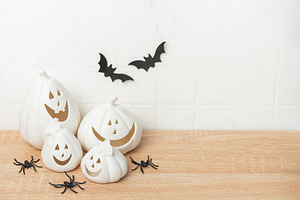 White ceramic pumpkins creating halloween festive decoration