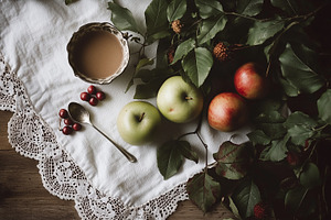Overhead shot of apples, ripe plums,, a Food & Drink Photo by Imaginarium