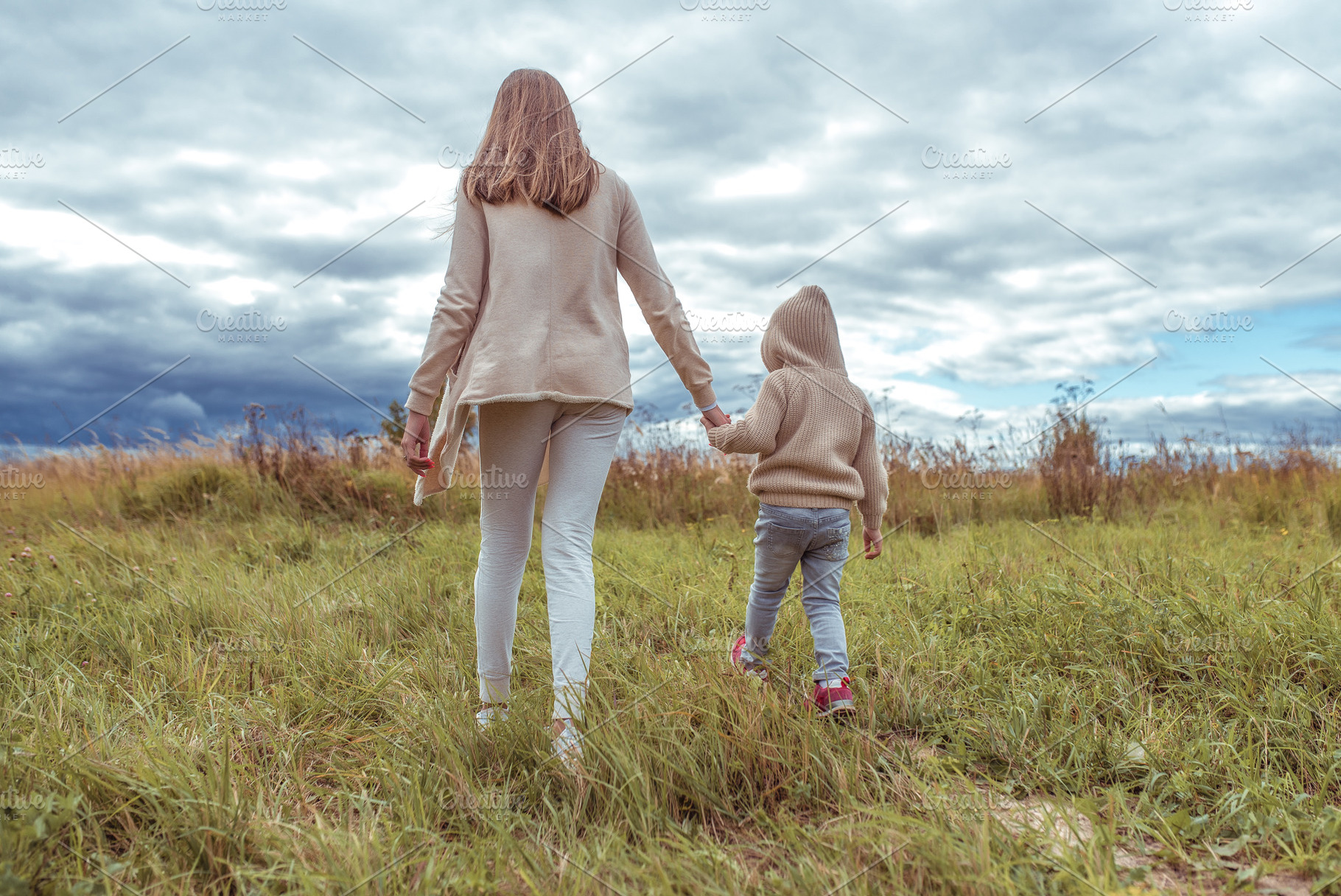 Woman mother walks with the child featuring emotion, playful, and day, a Person Photo by byswat