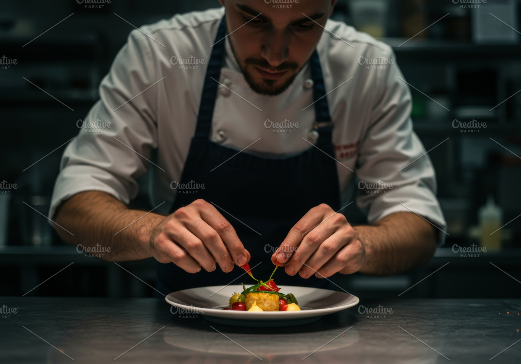 Chef carefully garnishes a dish, a Food & Drink Photo by professorinc