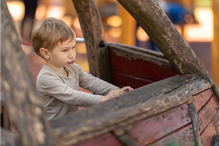 A little funny boy sitting in the, a Person Photo by Barcelona_dreams