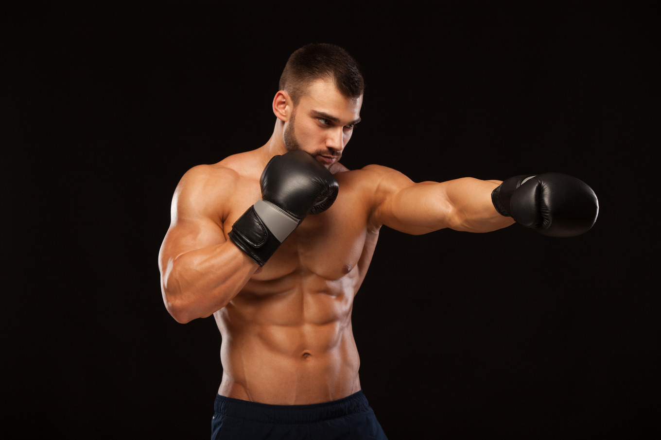 Muscular young man with perfect torso with six pack abs in boxing ...