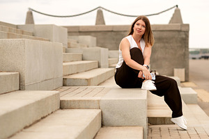 Young woman sitting on steps, a Person Photo by Elena Vagengeim
