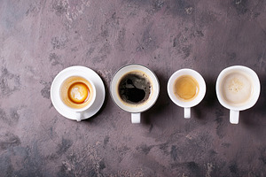 Fresh coffee in cups containing arabian, black coffee, and roast